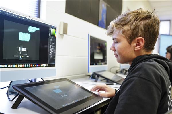 Commercial Art and Advertising Design students working on computers